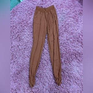 Rust colored joggers with ruched bottom